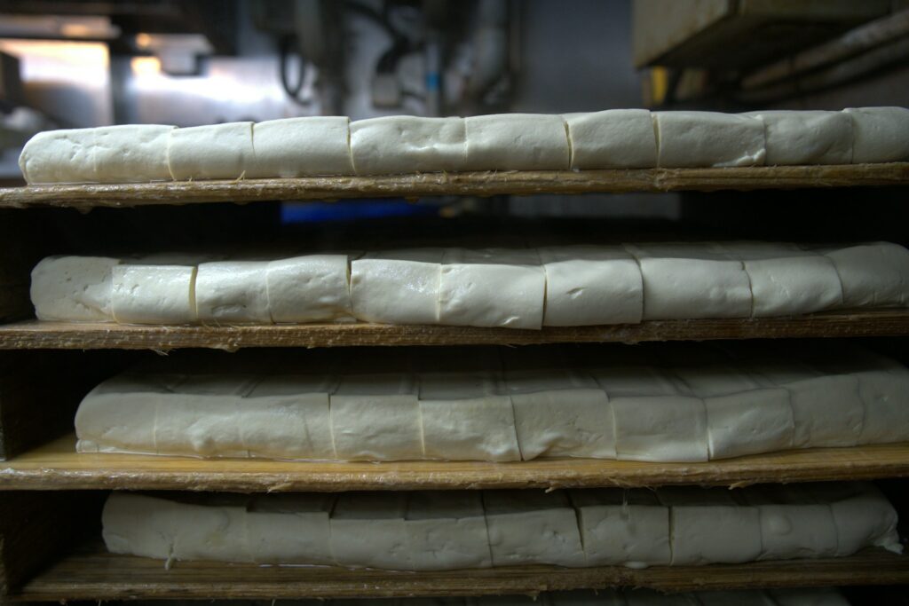 a bunch of bread that are on a shelf