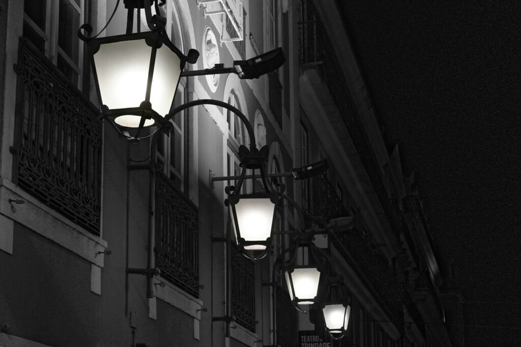 a row of street lights on a city street