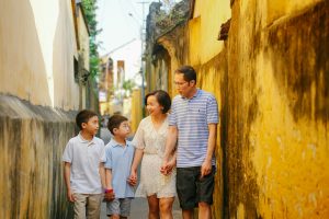a family walking down a narrow alley way