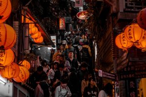 people walking on street during nighttime